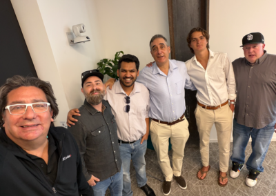 Joel Garcia and Luke Lightning with a workshop team member at the Claude Code event venue