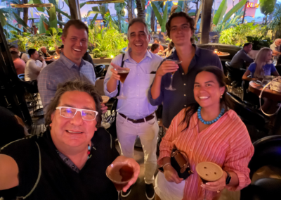 Joel and Luke with workshop attendees enjoying drinks during the post-event networking at the Irvine venue